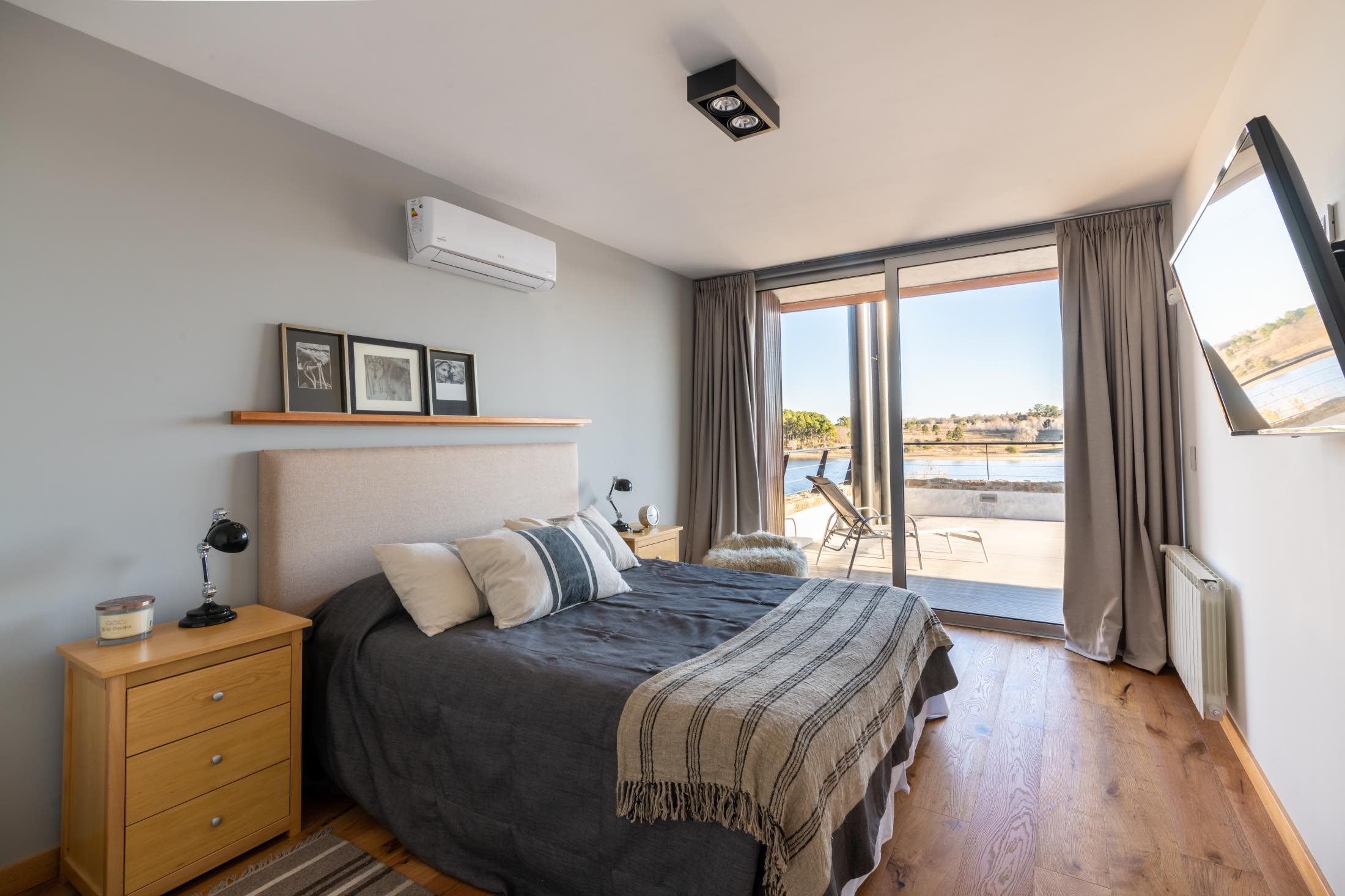bedroom with lake view through windows